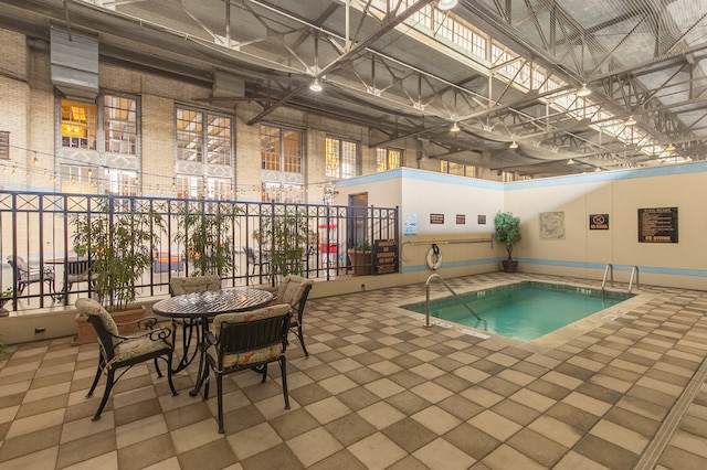 view of swimming pool featuring a patio area