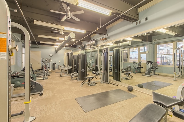 exercise room with ceiling fan