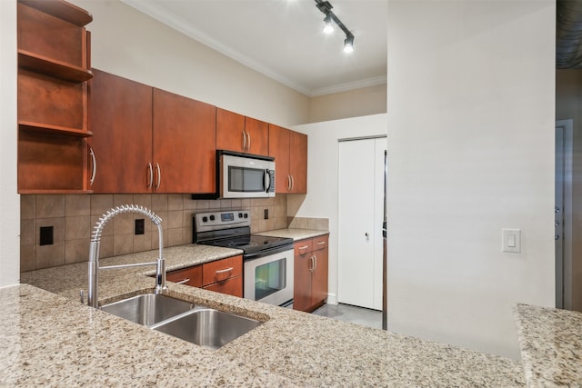 kitchen with tasteful backsplash, appliances with stainless steel finishes, sink, crown molding, and light stone counters