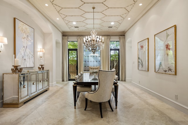 dining space featuring ornamental molding and a chandelier