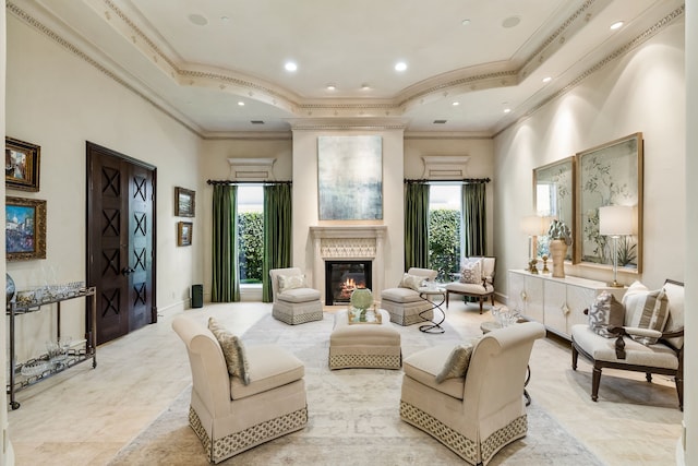 living area with crown molding and plenty of natural light