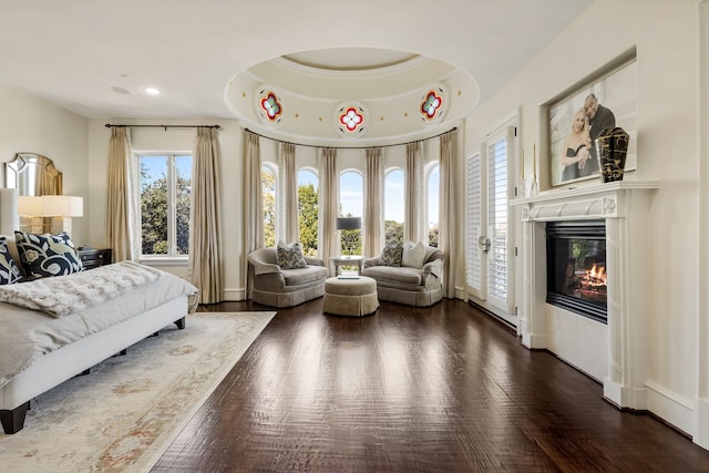 bedroom featuring access to outside and dark hardwood / wood-style floors