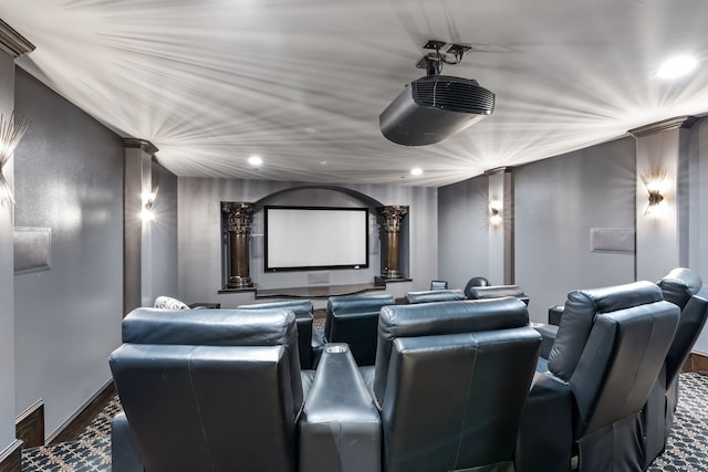 home theater featuring carpet and ornate columns