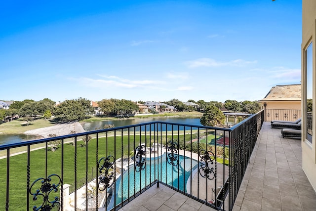 balcony featuring a water view