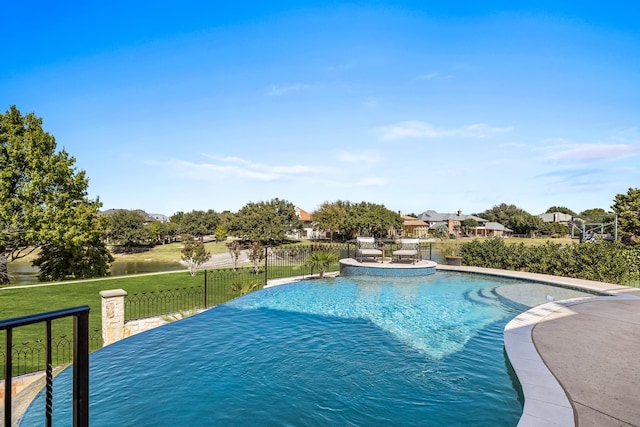 view of swimming pool featuring a lawn