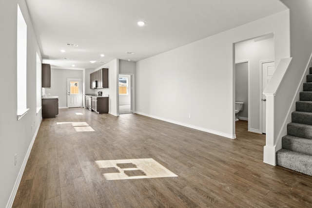 unfurnished living room featuring wood-type flooring