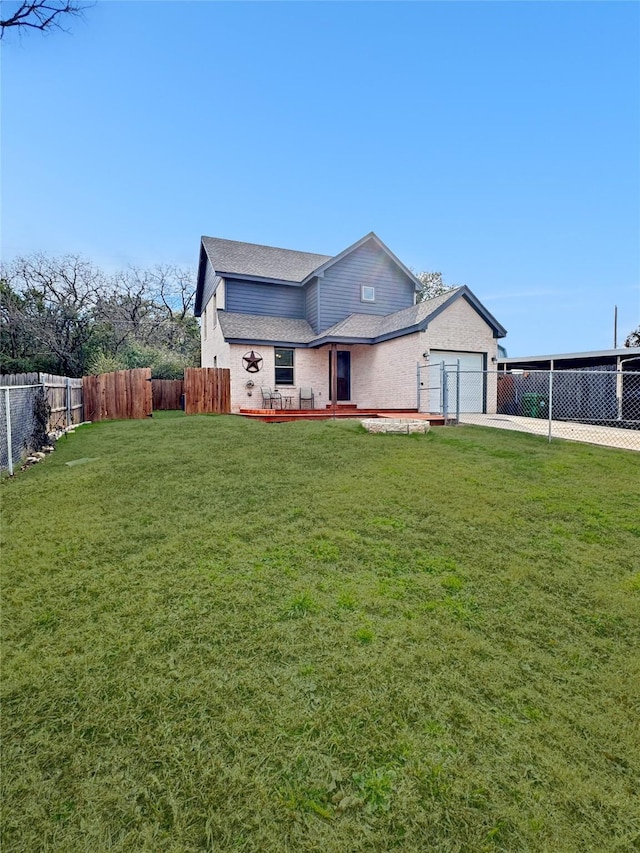 view of front of house featuring a garage and a front lawn