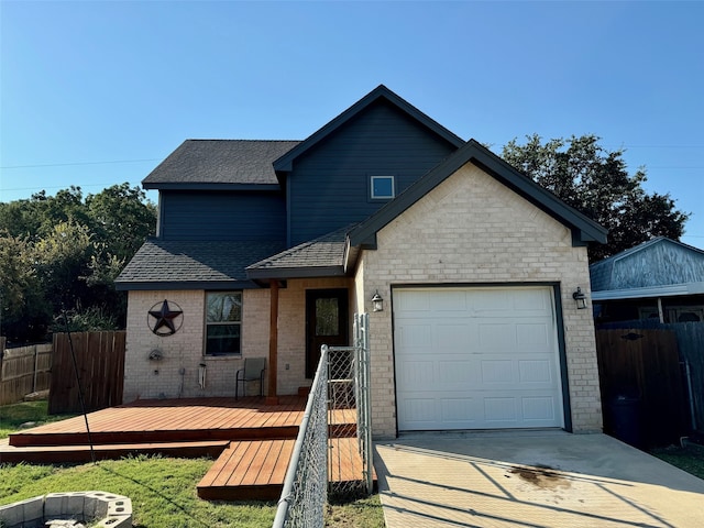 view of front facade with a wooden deck and a garage