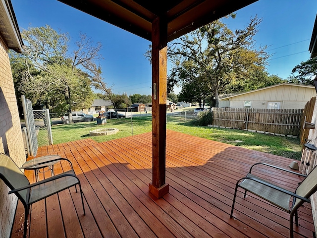 wooden deck with a lawn