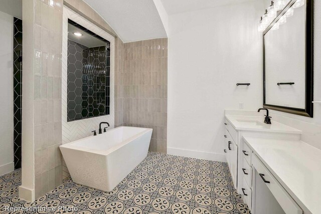 bathroom featuring vanity, tile walls, and independent shower and bath