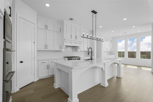 kitchen with visible vents, white cabinets, dark wood-style floors, light countertops, and recessed lighting