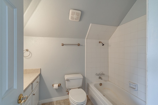 full bathroom with lofted ceiling, tile patterned floors, toilet, tiled shower / bath combo, and vanity