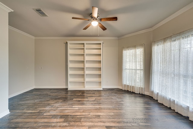 empty room featuring dark wood-type flooring, crown molding, and ceiling fan