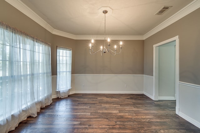 unfurnished dining area featuring crown molding, a notable chandelier, and dark hardwood / wood-style floors