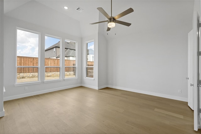 interior space with vaulted ceiling, ceiling fan, and plenty of natural light