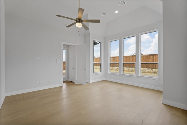 unfurnished living room featuring light hardwood / wood-style floors, lofted ceiling, and ceiling fan