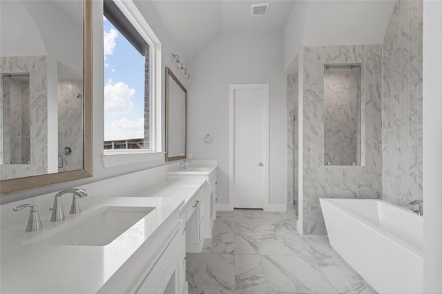 bathroom with vanity, a washtub, a wealth of natural light, and lofted ceiling