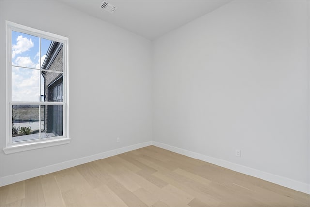 unfurnished room featuring light hardwood / wood-style flooring