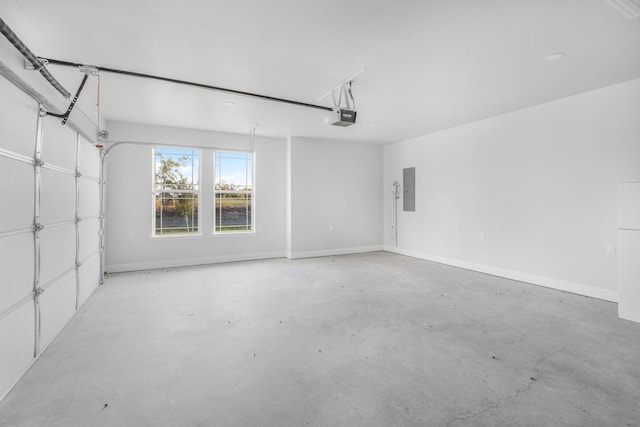 garage with electric panel and a garage door opener