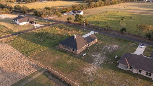 birds eye view of property with a rural view