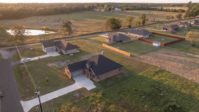 bird's eye view with a rural view and a water view