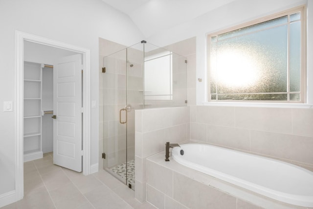 bathroom featuring tile patterned floors, lofted ceiling, and plus walk in shower