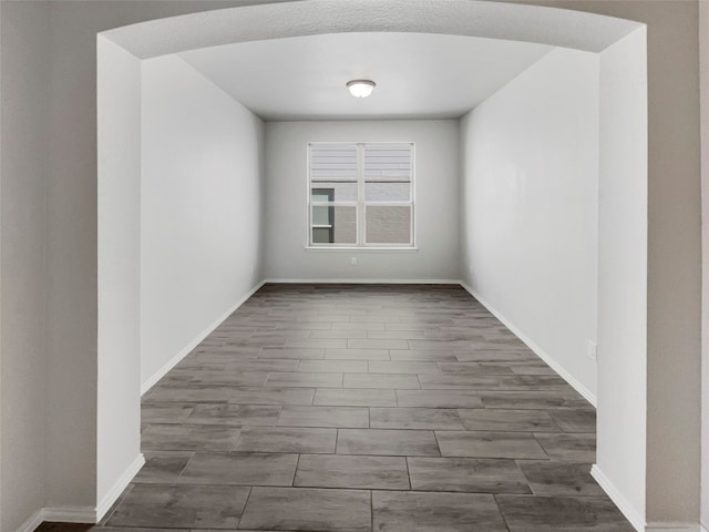 spare room featuring dark hardwood / wood-style flooring