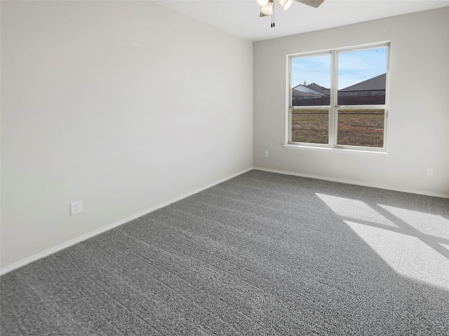 unfurnished room with ceiling fan and carpet floors