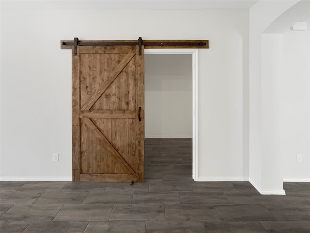 spare room with a barn door