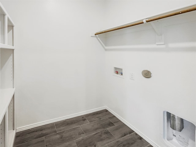 laundry room with washer hookup and dark hardwood / wood-style flooring