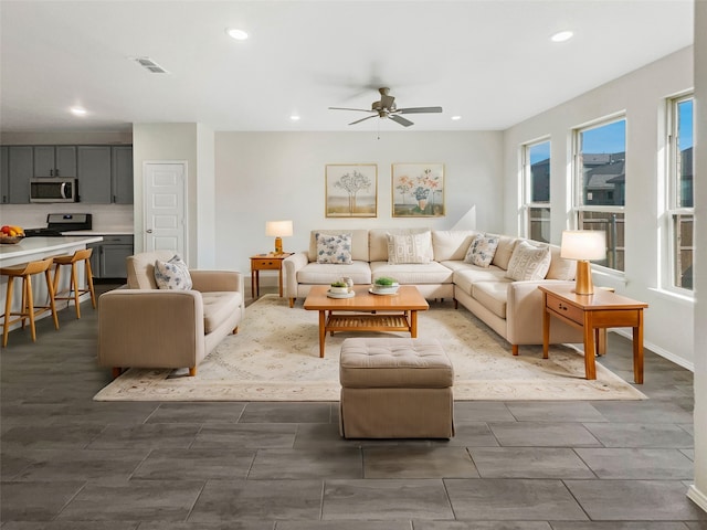 living room featuring ceiling fan