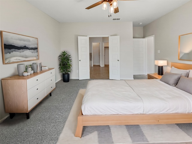 carpeted bedroom with ceiling fan