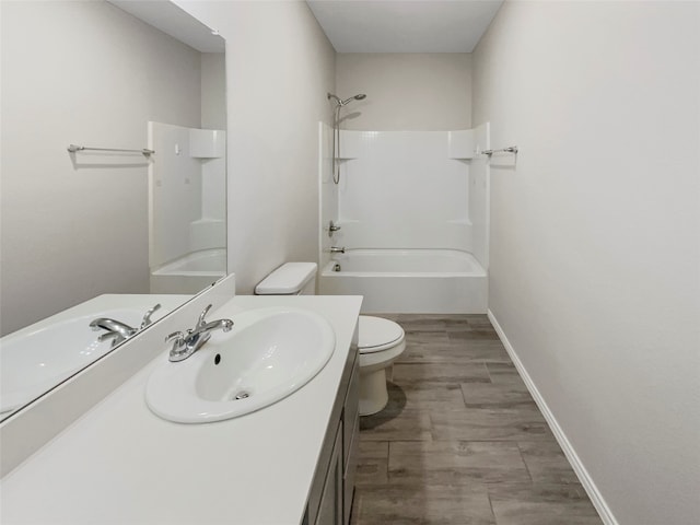 full bathroom featuring vanity, toilet, and washtub / shower combination