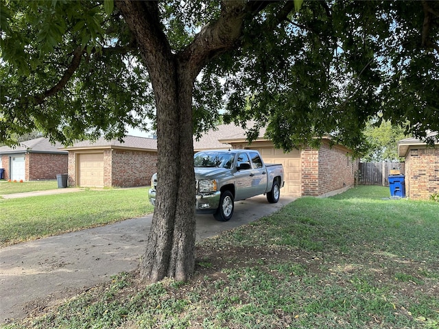 1428 Briar Cir, Crowley, TX 76036 - exterior space with an attached garage, concrete driveway, and fence