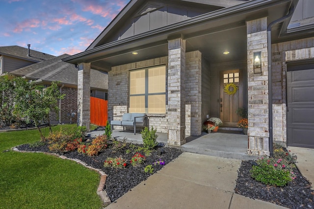 exterior entry at dusk with a porch