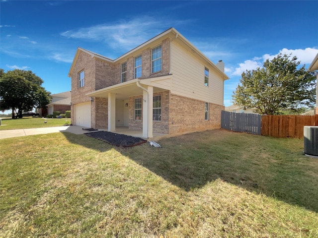 view of property exterior featuring central air condition unit, a garage, and a lawn