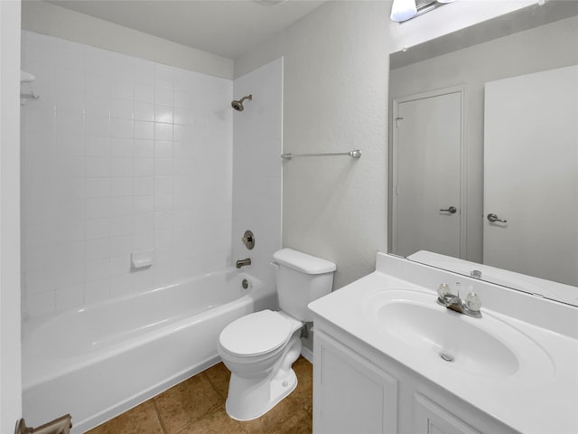 full bathroom with vanity, tiled shower / bath combo, toilet, and tile patterned flooring