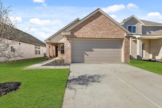 view of front of property featuring a front yard and a garage