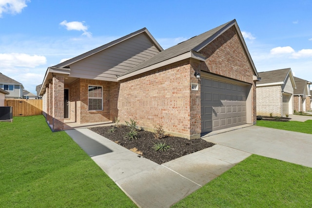 view of front of house with cooling unit, a garage, and a front lawn