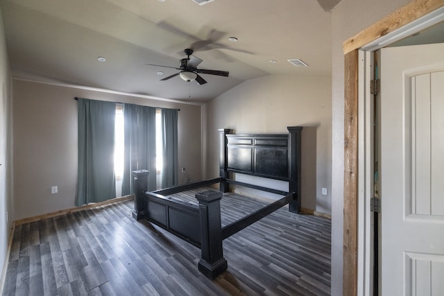 unfurnished bedroom with ceiling fan, lofted ceiling, and dark hardwood / wood-style flooring