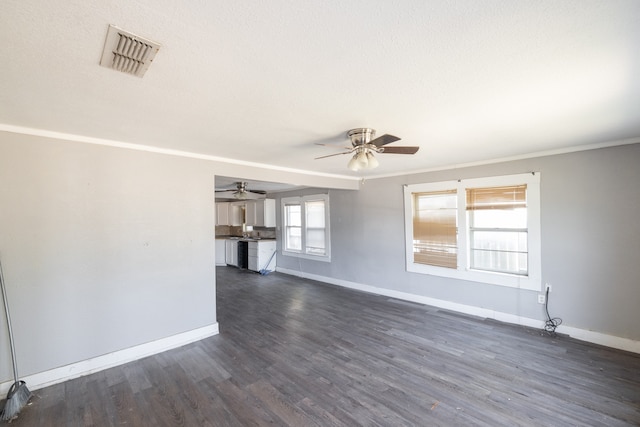 unfurnished living room featuring crown molding, dark hardwood / wood-style floors, a textured ceiling, and ceiling fan