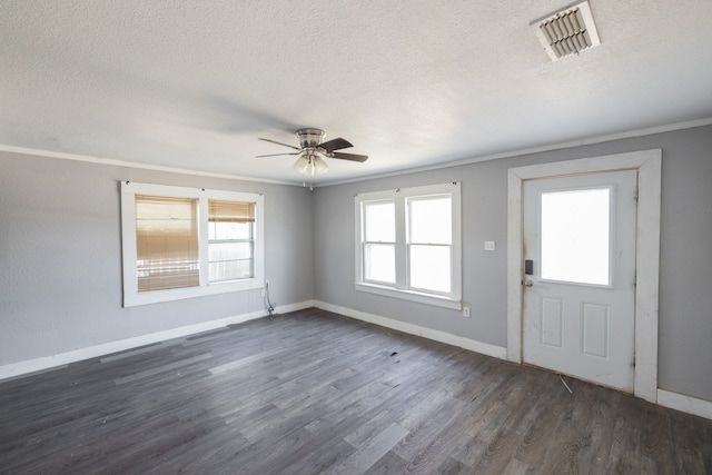 foyer entrance featuring ornamental molding, a textured ceiling, dark hardwood / wood-style floors, and ceiling fan