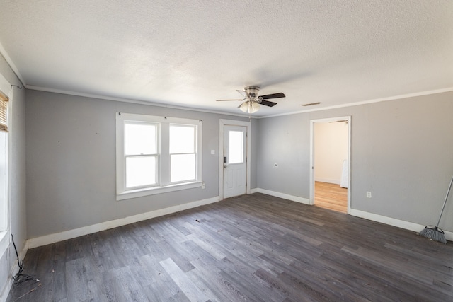 unfurnished room featuring ornamental molding, a textured ceiling, dark hardwood / wood-style floors, and ceiling fan