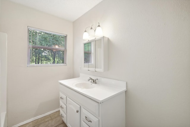 bathroom with tile patterned flooring and vanity