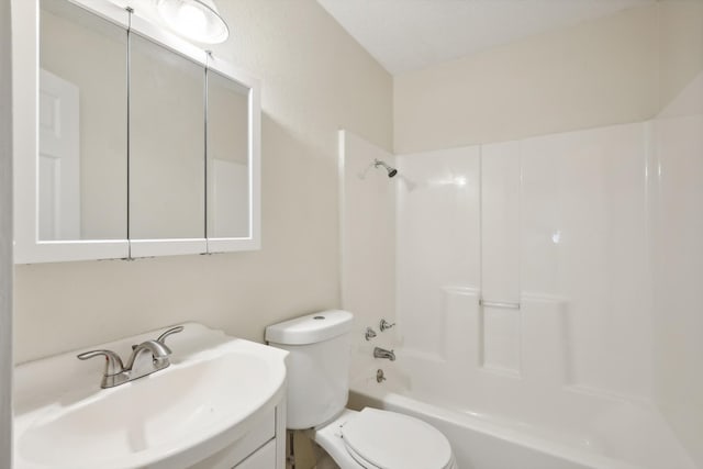 full bathroom with vanity, shower / bath combination, and toilet