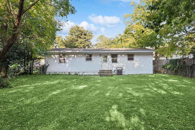 back of house featuring a yard