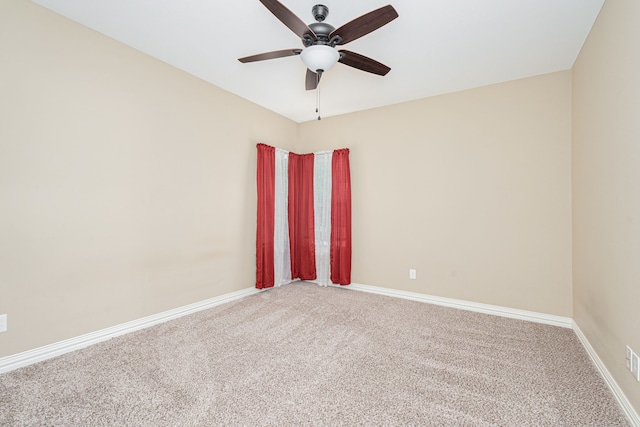 empty room featuring carpet and ceiling fan