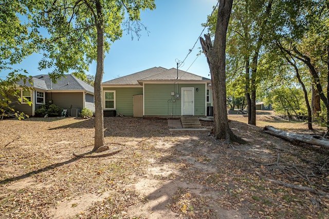 rear view of house with central AC