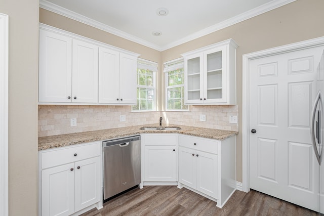 kitchen with stainless steel dishwasher, white cabinets, and wood-type flooring