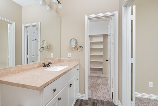 bathroom with vanity and wood-type flooring